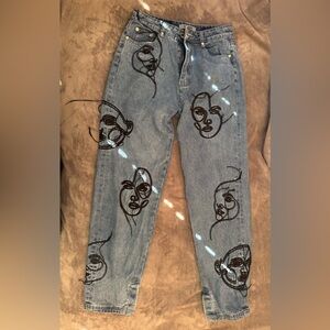 Artistic Face Embroidered Blue Jeans